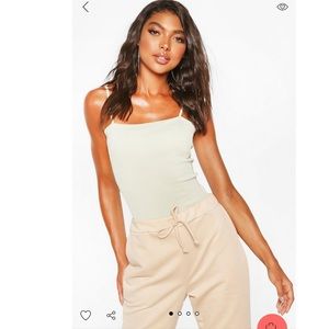 BooHoo sage green basic ribbed strapping bodysuit